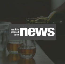 SLTN Logo Image Overlay sltn logo over an image of whisky being poured into glasses